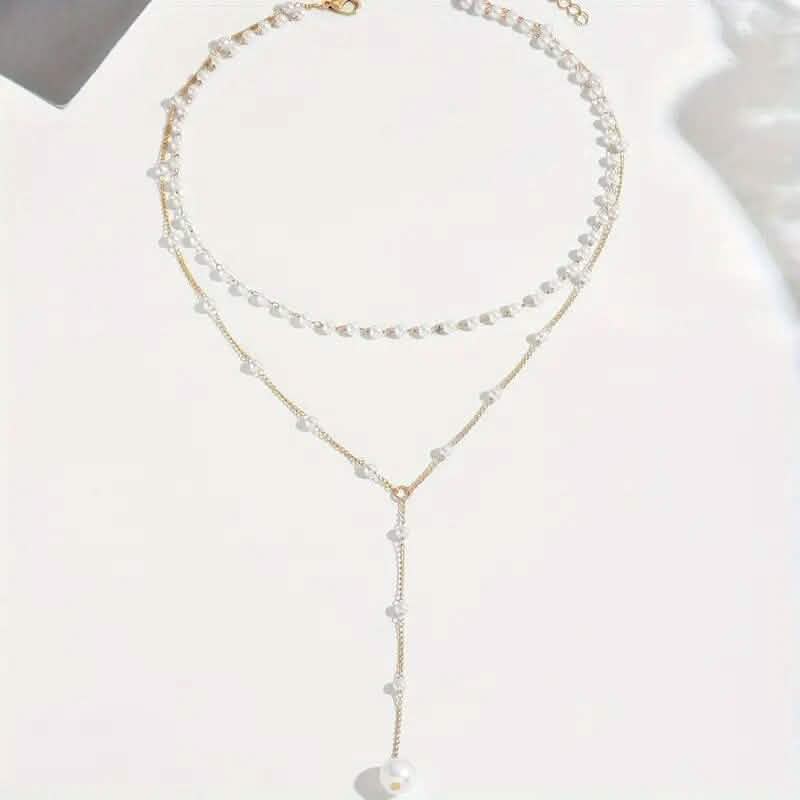 Elegant Vintage Style Double-Layer Pendant Necklace with Imitation Pearl Accents and Tassel Drop