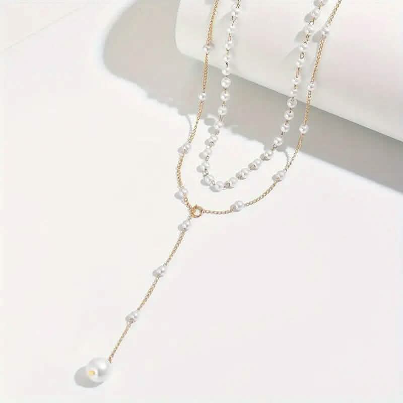 Elegant Vintage Style Double-Layer Pendant Necklace with Imitation Pearl Accents and Tassel Drop